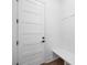 Bright entryway featuring a white door with black hardware and a built-in bench at 302 Lincoln St, Belmont, NC 28012