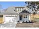 Charming home featuring a covered front porch, attached garage, and freshly installed yard with new landscaping at 302 Lincoln St, Belmont, NC 28012