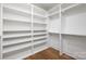 Spacious walk-in closet featuring custom shelving and hardwood floors, offering ample storage space at 302 Lincoln St, Belmont, NC 28012