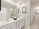 Bright bathroom with double sink vanity, framed mirrors, and stylish fixtures at 313 Alden Ct, Shelby, NC 28152
