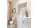 Well-lit bathroom featuring a single sink vanity, white cabinets, and a shower with a patterned curtain at 313 Alden Ct, Shelby, NC 28152
