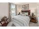 Inviting bedroom with a decorative headboard, patterned bedding, and a window with natural light at 313 Alden Ct, Shelby, NC 28152