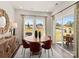 Bright dining room with a round table, stylish decor, and sliding glass doors leading to the outdoors at 313 Alden Ct, Shelby, NC 28152