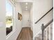 Welcoming entryway featuring a staircase, modern lighting, wood floors, and neutral wall color at 313 Alden Ct, Shelby, NC 28152