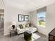 Cozy sitting area with an overstuffed couch, an ottoman and a light-filled window at 313 Alden Ct, Shelby, NC 28152