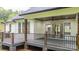 Wooden back porch with a fan and access to the house through glass sliding doors at 3732 Whitney Ne Dr, Hickory, NC 28601