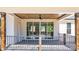 Covered wooden back porch with a ceiling fan, offering a relaxing outdoor space at 3732 Whitney Ne Dr, Hickory, NC 28601