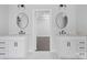 Bathroom featuring dual vanities, each with white cabinets, white countertops, and elegant mirrors, creating a symmetrical design at 3732 Whitney Ne Dr, Hickory, NC 28601