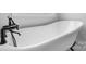 Close-up of a freestanding bathtub showcases its classic design and vintage-style fixtures at 3732 Whitney Ne Dr, Hickory, NC 28601