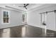 Bright bedroom with hardwood floors, recessed lighting, natural light from windows, and a sliding door at 3732 Whitney Ne Dr, Hickory, NC 28601
