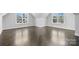 Spacious room with hardwood flooring and natural light streaming through large windows at 3732 Whitney Ne Dr, Hickory, NC 28601