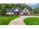 Beautifully landscaped home with stone accents and a pristine front lawn at 3732 Whitney Ne Dr, Hickory, NC 28601