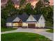 Stunning two-story home featuring a welcoming front porch, attached garage, and lush green lawn at 3732 Whitney Ne Dr, Hickory, NC 28601