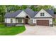 Charming modern home with white siding, stone accents, and a well-manicured lawn at 3732 Whitney Ne Dr, Hickory, NC 28601