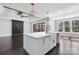 This open kitchen features a large island, modern fixtures and flows into the living room at 3732 Whitney Ne Dr, Hickory, NC 28601