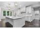 Bright kitchen features a large island, white cabinets, and modern fixtures at 3732 Whitney Ne Dr, Hickory, NC 28601