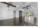 Open living area features wood floors, fireplace, ceiling beams, and backyard access at 3732 Whitney Ne Dr, Hickory, NC 28601