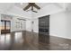 This spacious living room features a cozy fireplace, and beautiful hardwood floors at 3732 Whitney Ne Dr, Hickory, NC 28601