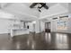 Open-concept space with kitchen island, white cabinets, and hardwood floors at 3732 Whitney Ne Dr, Hickory, NC 28601