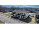 Aerial view of townhouses featuring covered porches, landscaped yards, and community streetscape at 3931 Newhall Nw Dr, Hickory, NC 28601