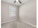 Cozy bedroom with neutral carpet, a window with blinds, and a ceiling fan at 3931 Newhall Nw Dr, Hickory, NC 28601