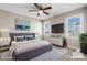 Staged bedroom with a ceiling fan and natural light at 3931 Newhall Nw Dr, Hickory, NC 28601
