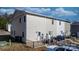 Townhouse back exterior featuring individual patios, rear entrances, and adjacent parking at 3931 Newhall Nw Dr, Hickory, NC 28601