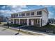 Inviting townhouse with charming stone accents, cozy porch seating, and well-maintained landscaping at 3931 Newhall Nw Dr, Hickory, NC 28601