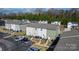 Exterior view of townhouses showcasing siding, parking areas, and landscaped grounds at 3931 Newhall Nw Dr, Hickory, NC 28601