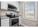 Modern kitchen with stainless steel appliances, granite countertops, and bright natural light at 3931 Newhall Nw Dr, Hickory, NC 28601