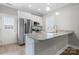 Bright kitchen features stainless steel appliances, granite countertops, and ample cabinet space at 3931 Newhall Nw Dr, Hickory, NC 28601