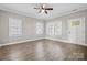 Bright living room with hardwood floors, white trim, and large windows at 3931 Newhall Nw Dr, Hickory, NC 28601