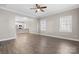 Open-concept living room showcasing hardwood floors, neutral walls, and an adjoining kitchen at 3931 Newhall Nw Dr, Hickory, NC 28601