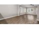 Bright and open living room with neutral paint, flooring, and lots of natural light at 3931 Newhall Nw Dr, Hickory, NC 28601