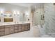 Luxurious bathroom boasts marble floors, double sink vanity, glass shower, and soaking tub at 4354 Persimmon Rd, Lancaster, SC 29720