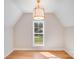 Well-lit bedroom featuring hardwood floors and a large window with scenic outdoor views at 4354 Persimmon Rd, Lancaster, SC 29720