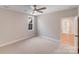 Inviting carpeted bedroom with a ceiling fan, window, and access to an ensuite bathroom at 4354 Persimmon Rd, Lancaster, SC 29720