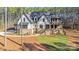 Beautiful exterior of a home with stone accents, a covered front porch and meticulous landscaping at 4354 Persimmon Rd, Lancaster, SC 29720