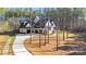 Exterior view showing the light home with a side entry garage and long drive at 4354 Persimmon Rd, Lancaster, SC 29720