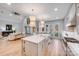 Open concept kitchen featuring a center island with an adjacent living room at 4354 Persimmon Rd, Lancaster, SC 29720