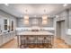 Gourmet kitchen with oversized island, pendant lighting, and stainless steel appliances at 4354 Persimmon Rd, Lancaster, SC 29720