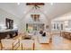 Spacious living room featuring a vaulted ceiling, a fireplace, and an open concept with the kitchen at 4354 Persimmon Rd, Lancaster, SC 29720