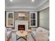 Sitting room with fireplace, white trim, olive green walls, and natural light at 4354 Persimmon Rd, Lancaster, SC 29720