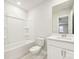 A clean, well lit bathroom featuring a shower-tub combo and single vanity sink with white cabinets at 5013 Poplin Vly, Cherryville, NC 28021