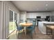 Bright dining area with wood floors, a round table, and sliding glass doors at 5013 Poplin Vly, Cherryville, NC 28021