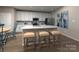 Contemporary kitchen with white cabinets, a center island, and stainless steel appliances at 5013 Poplin Vly, Cherryville, NC 28021