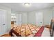 Cozy bedroom with a quilt-covered bed and white doors at 5053 Marci Ln, Belmont, NC 28012