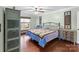 Comfortable bedroom with hardwood floors, ceiling fan and a large window with bench seating at 5053 Marci Ln, Belmont, NC 28012