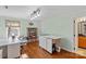 Another view of the bright craft room featuring hardwood floors and natural light at 5053 Marci Ln, Belmont, NC 28012