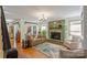Inviting living room featuring a fireplace, hardwood floors and doors leading to the outside at 5053 Marci Ln, Belmont, NC 28012